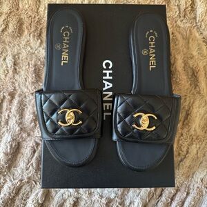 CHANEL Black Quilted Slides with Gold Logo